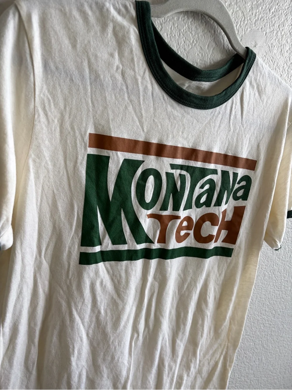 Montana Tech Cream Ringer Tee with Green & Brown Logo